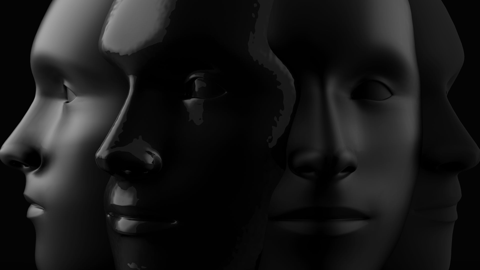 Three sculpted faces layered in black and grey